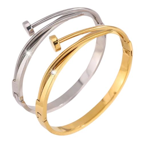 Goud- en zilverkleurige spijkervormige gesloten bangle met zirkonia steentjes