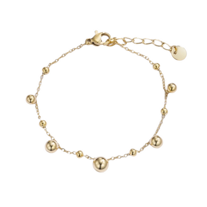 Goudkleurige armband met diverse grootte bolletjes - speelse dames armband 