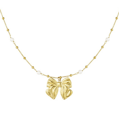Goudkleurige parelketting met elegante strikhanger – romantische en verfijnde damesketting met subtiele pareldetails