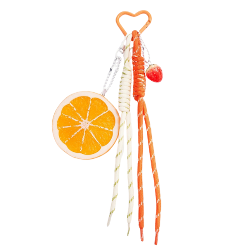 Zomerse bagcharm met oranje tinten - een frisse, fruitige versiering voor aan je tas