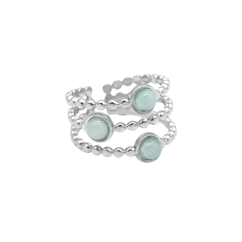 Zilverkleurige RVS ring met drie lagen bolletjes en drie lichte blauwgroene steentjes – verfijnd damesaccessoire.